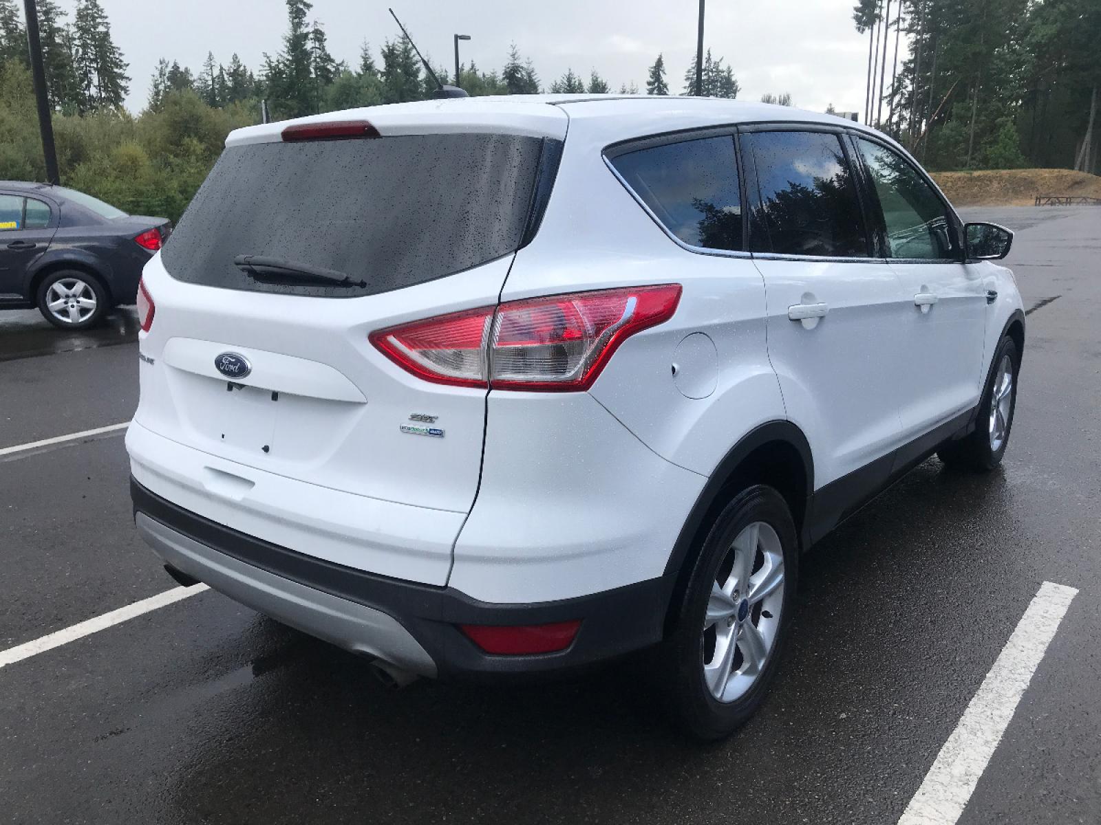 2014 White /White Ford Escape SE 4WD (1FMCU9GX7EU) with an 1.6L L4 DOHC 16V engine, 6-Speed Automatic transmission, located at 1283 SE Sedgwick Road, Port Orchard, WA, 98366, (360) 876-9300, 47.505535, -122.635643 - **Dealer Statement**, The Trade Store offers the nicest previously owned inventory you'll find along with a broad selection of cars, vans, trucks and more. We offer many banks, credit unions and special financing options to fit your needs regardless of your credit, as well as, sourcing of specific v - Photo #2