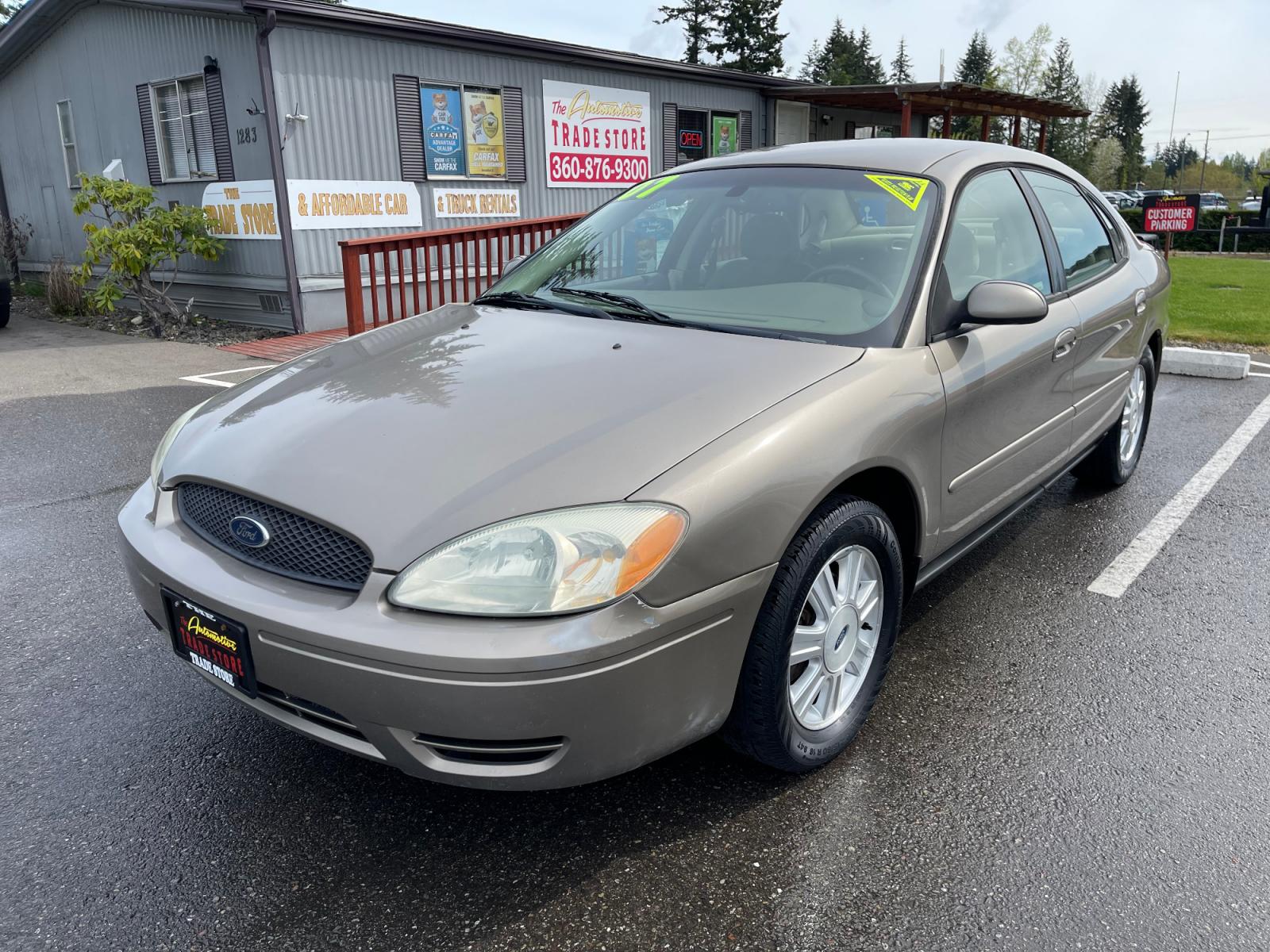 2007 Gold /Tan Ford Taurus SEL (1FAFP56U97A) with an 3.0L V6 OHV 12V engine, Automatic transmission, located at 1283 SE Sedgwick Road, Port Orchard, WA, 98366, (360) 876-9300, 47.505535, -122.635643 - Photo #1