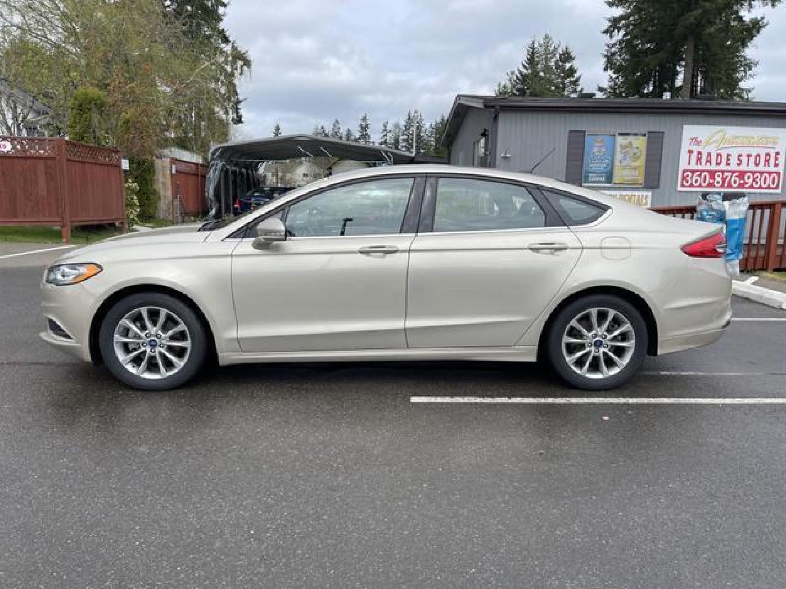 2017 Gold /Black Ford Fusion SE Sedan 4D (3FA6P0H78HR) with an 2.5L L4 DOHC 16V engine, Auto, 6-Spd SelectShift transmission, located at 1283 SE Sedgwick Road, Port Orchard, WA, 98366, (360) 876-9300, 47.505535, -122.635643 - **Dealer Statement: The Trade Store offers the nicest previously owned inventory you'll find of cars, vans, trucks and more. We offer many banks, credit unions and special financing options to fit your needs regardless of your credit, as well as sourcing of specific vehicles for qualified custom - Photo #2