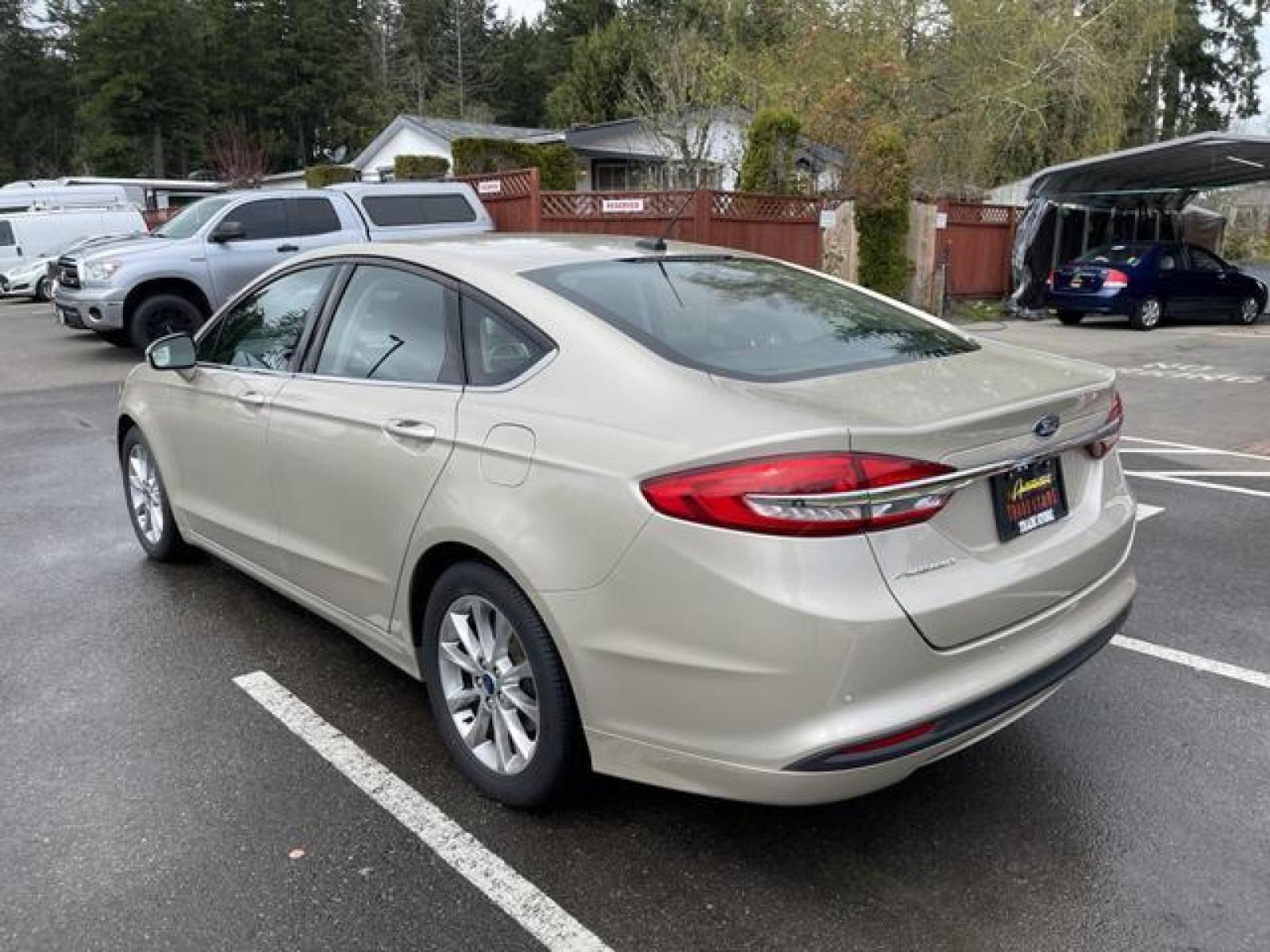 2017 Gold /Black Ford Fusion SE Sedan 4D (3FA6P0H78HR) with an 2.5L L4 DOHC 16V engine, Auto, 6-Spd SelectShift transmission, located at 1283 SE Sedgwick Road, Port Orchard, WA, 98366, (360) 876-9300, 47.505535, -122.635643 - **Dealer Statement: The Trade Store offers the nicest previously owned inventory you'll find of cars, vans, trucks and more. We offer many banks, credit unions and special financing options to fit your needs regardless of your credit, as well as sourcing of specific vehicles for qualified custom - Photo #3