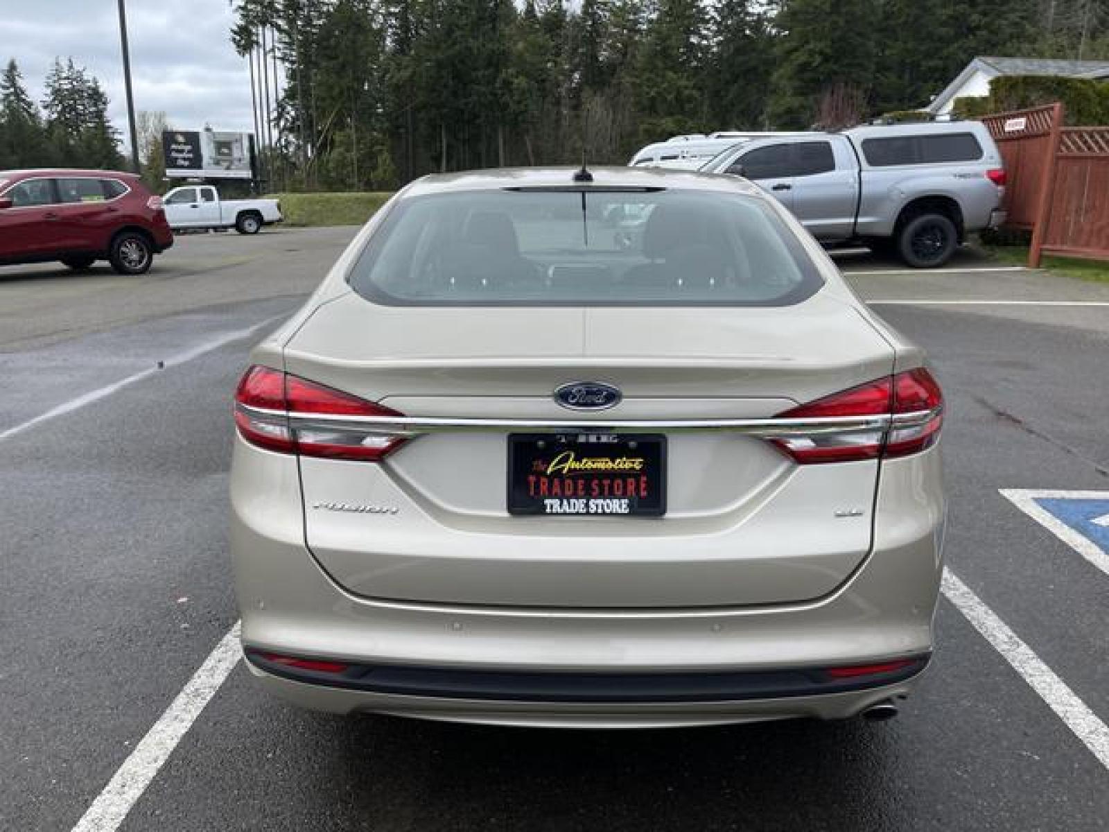 2017 Gold /Black Ford Fusion SE Sedan 4D (3FA6P0H78HR) with an 2.5L L4 DOHC 16V engine, Auto, 6-Spd SelectShift transmission, located at 1283 SE Sedgwick Road, Port Orchard, WA, 98366, (360) 876-9300, 47.505535, -122.635643 - **Dealer Statement: The Trade Store offers the nicest previously owned inventory you'll find of cars, vans, trucks and more. We offer many banks, credit unions and special financing options to fit your needs regardless of your credit, as well as sourcing of specific vehicles for qualified custom - Photo #4
