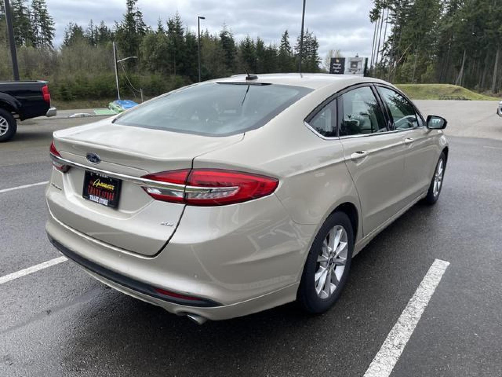 2017 Gold /Black Ford Fusion SE Sedan 4D (3FA6P0H78HR) with an 2.5L L4 DOHC 16V engine, Auto, 6-Spd SelectShift transmission, located at 1283 SE Sedgwick Road, Port Orchard, WA, 98366, (360) 876-9300, 47.505535, -122.635643 - **Dealer Statement: The Trade Store offers the nicest previously owned inventory you'll find of cars, vans, trucks and more. We offer many banks, credit unions and special financing options to fit your needs regardless of your credit, as well as sourcing of specific vehicles for qualified custom - Photo #5