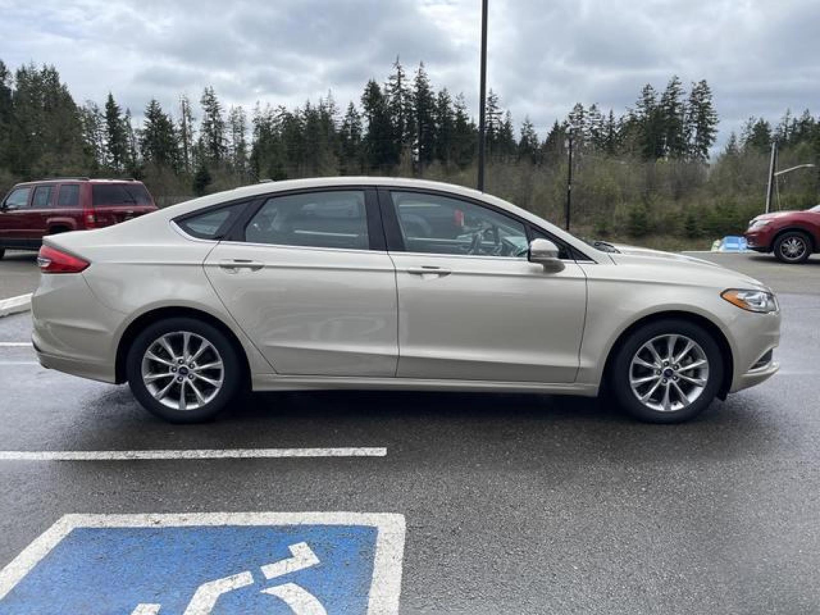 2017 Gold /Black Ford Fusion SE Sedan 4D (3FA6P0H78HR) with an 2.5L L4 DOHC 16V engine, Auto, 6-Spd SelectShift transmission, located at 1283 SE Sedgwick Road, Port Orchard, WA, 98366, (360) 876-9300, 47.505535, -122.635643 - **Dealer Statement: The Trade Store offers the nicest previously owned inventory you'll find of cars, vans, trucks and more. We offer many banks, credit unions and special financing options to fit your needs regardless of your credit, as well as sourcing of specific vehicles for qualified custom - Photo #6