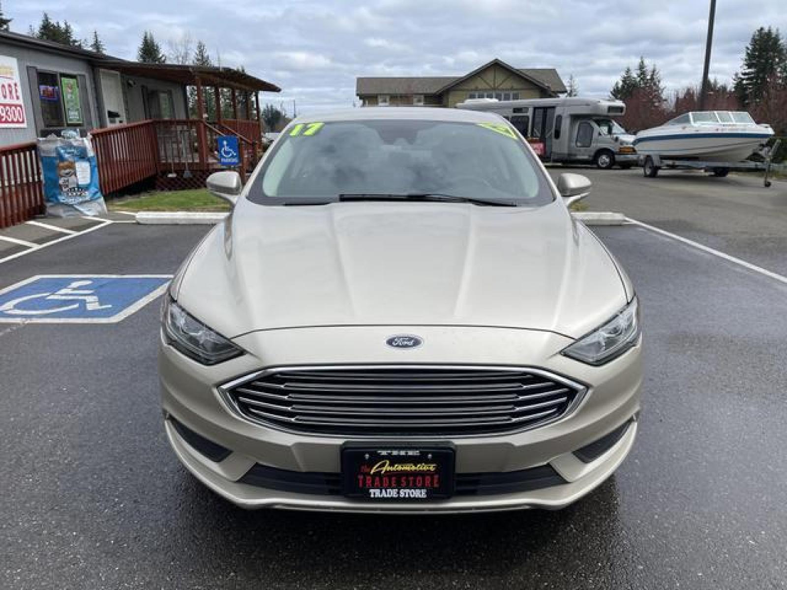 2017 Gold /Black Ford Fusion SE Sedan 4D (3FA6P0H78HR) with an 2.5L L4 DOHC 16V engine, Auto, 6-Spd SelectShift transmission, located at 1283 SE Sedgwick Road, Port Orchard, WA, 98366, (360) 876-9300, 47.505535, -122.635643 - **Dealer Statement: The Trade Store offers the nicest previously owned inventory you'll find of cars, vans, trucks and more. We offer many banks, credit unions and special financing options to fit your needs regardless of your credit, as well as sourcing of specific vehicles for qualified custom - Photo #8
